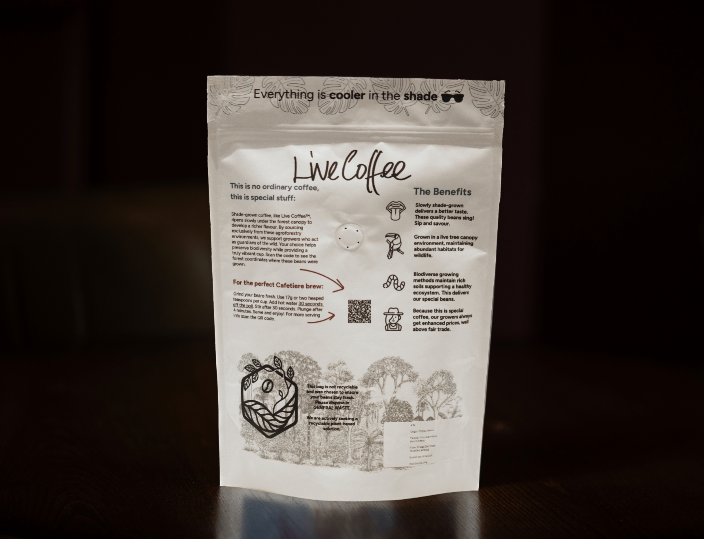 Coffee package with text and graphics on a dark background